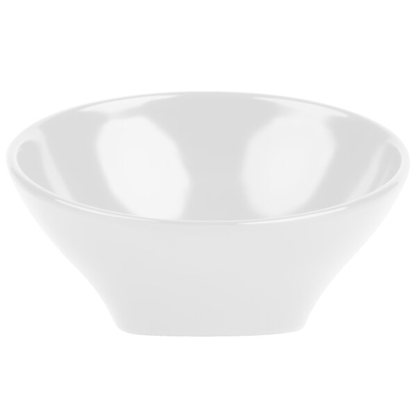 A close-up of a white Elite Global Solutions Pappasan melamine bowl with a slanted edge.