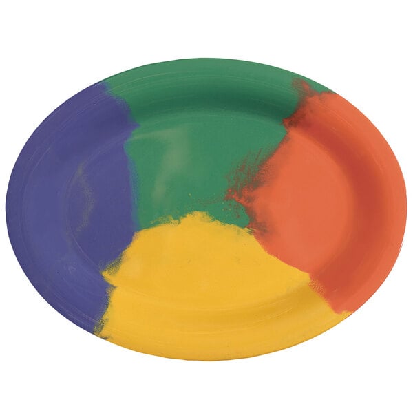 A close-up of a white oval platter with yellow and green paint designs on it.