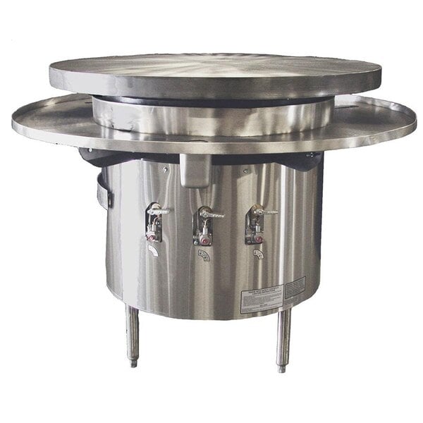 A Town Liquid Propane Flat Top Mongolian BBQ Range with a large round metal top.