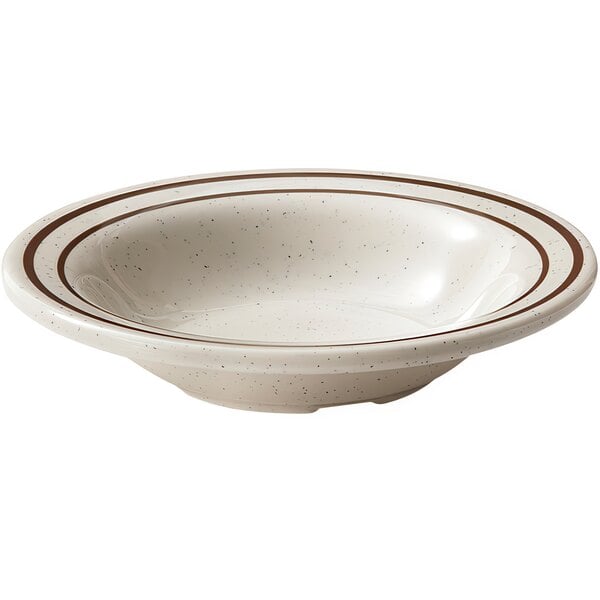 A white GET Ultraware ironstone bowl with brown speckled rim.