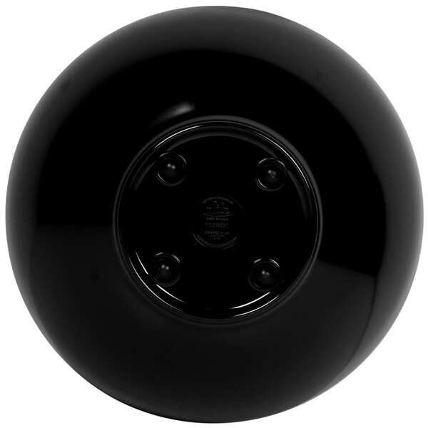 A black round Elite Global Solutions melamine bowl with a sunburst pattern on the bottom.