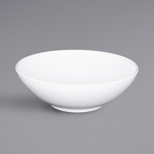 An Elite Global Solutions Sunburst white melamine bowl with a handle.