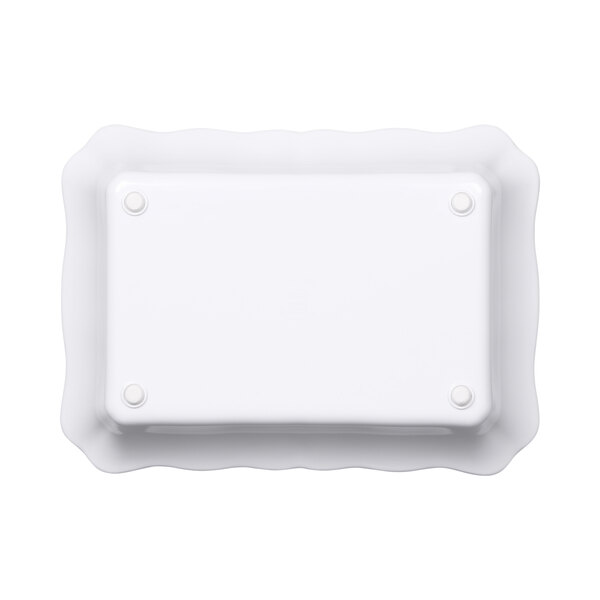 A white rectangular melamine dish with a scalloped edge.
