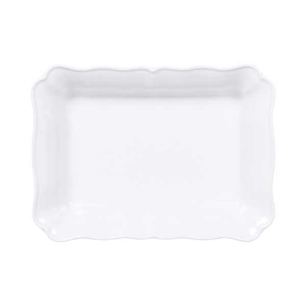 A white rectangular melamine dish with a scalloped edge.