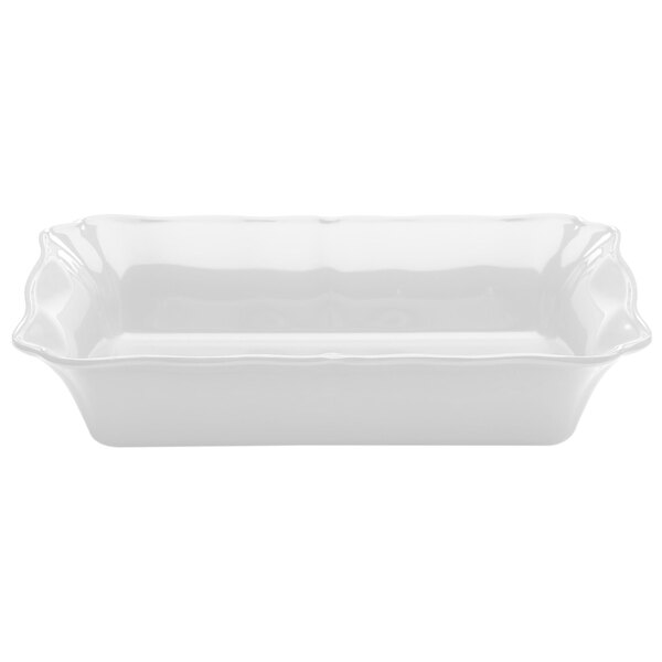 A white rectangular melamine dish with wavy edges.