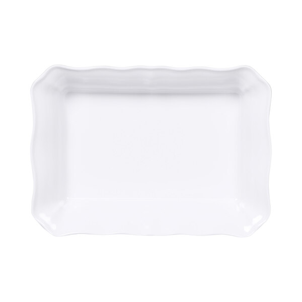A white rectangular melamine dish with scalloped edges.