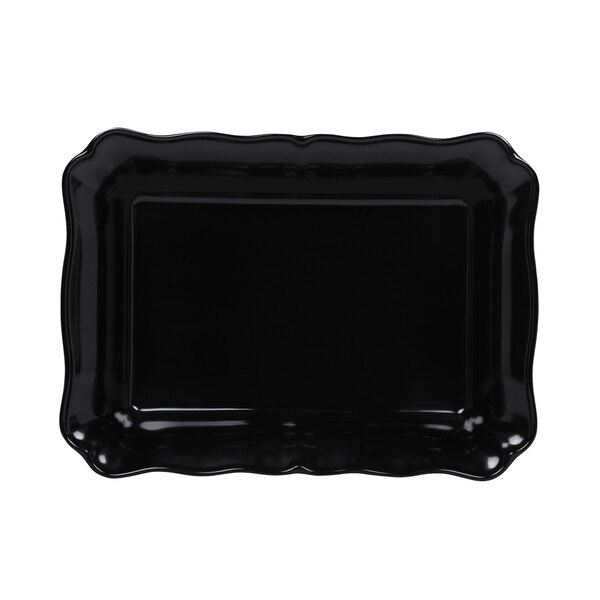 A black rectangular melamine dish with scalloped edges.
