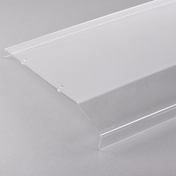 A clear plastic shelf on a white surface.