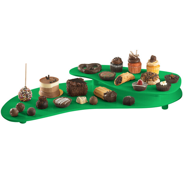A green Tablecraft two tiered platter holding various desserts.