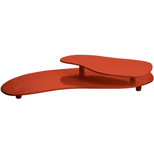 A copper cast aluminum Tablecraft two tiered platter on a red table.