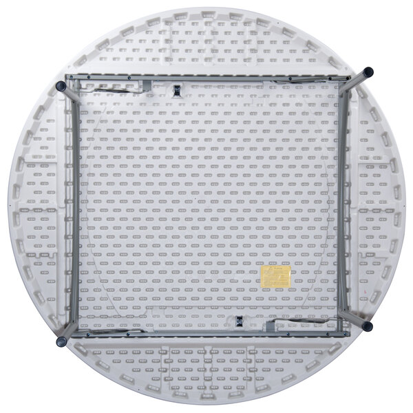 A white Flash Furniture round folding table with metal legs.