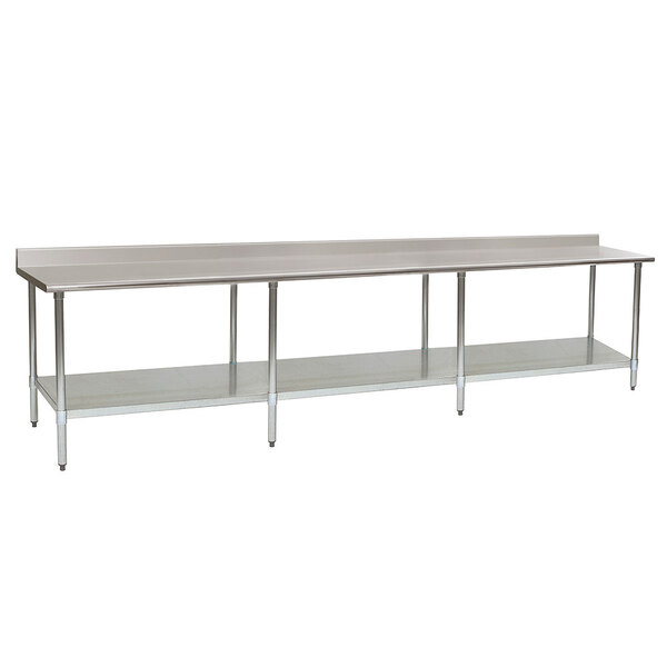 A long stainless steel Eagle Group work table with a galvanized undershelf.