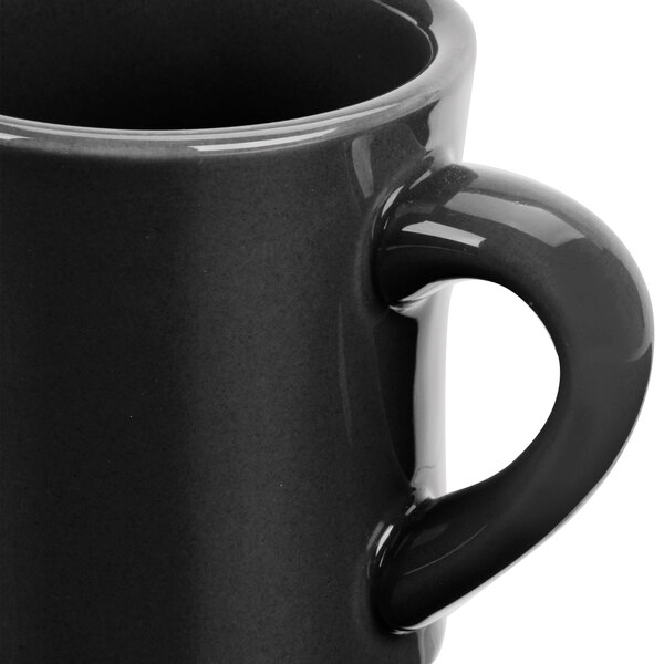 A close-up of a black CAC Venice Hartford mug with a handle.