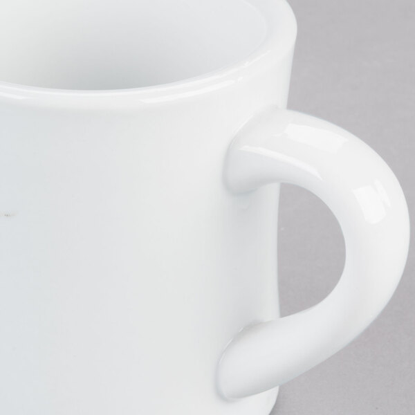 A close-up of a CAC Hartford white porcelain mug with a handle.