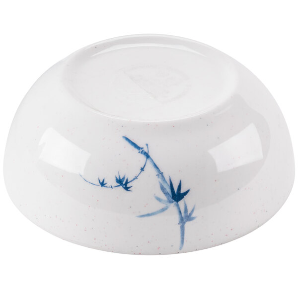 A white bowl with blue and white bamboo design.