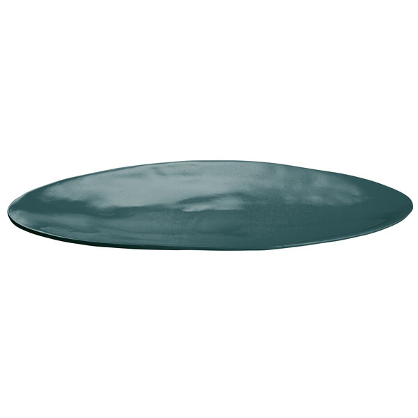 A Tablecraft hunter green cast aluminum oblong platter on a blue surface.