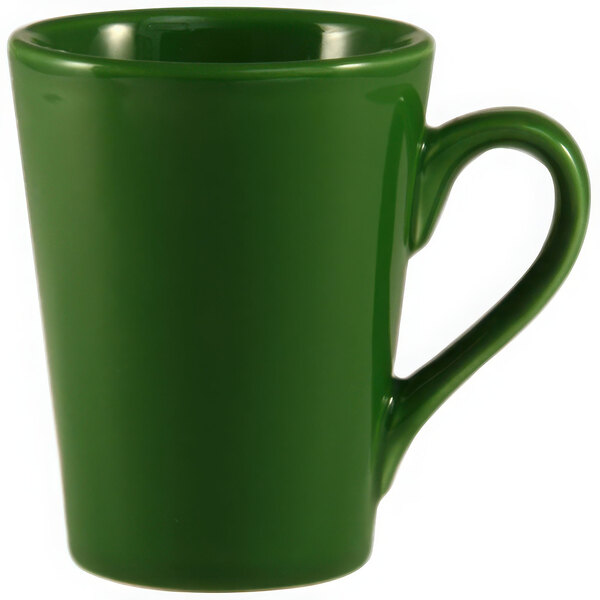 A green mug with a handle.