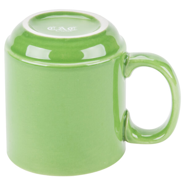A close-up of a green CAC Venice mug with a white handle.