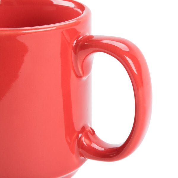 A close up of a red CAC Venice stacking mug with a handle.