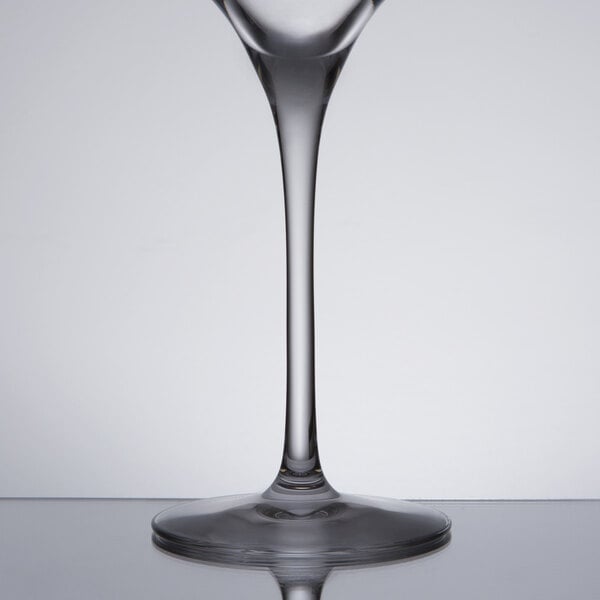 A Chef & Sommelier Tannic wine glass filled with wine on a table.