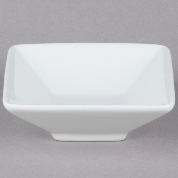 A Tuxton porcelain white mini footed square bowl.