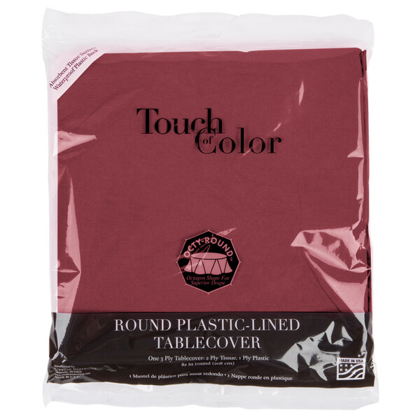 A package of burgundy Creative Converting table covers.