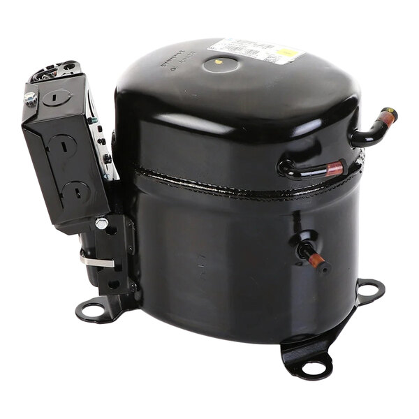 A black, cylindrical metal component with attached electrical parts and copper tubing, likely a refrigeration compressor.