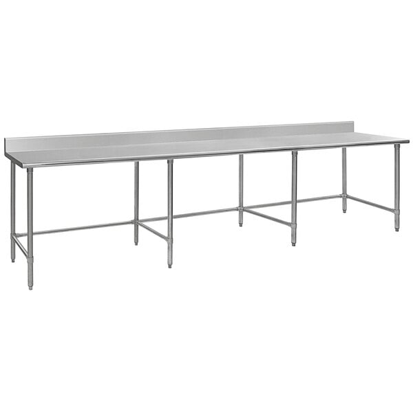 An Eagle Group stainless steel work table with open base and backsplash on metal legs.