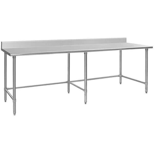 A long rectangular stainless steel work table with a metal base.