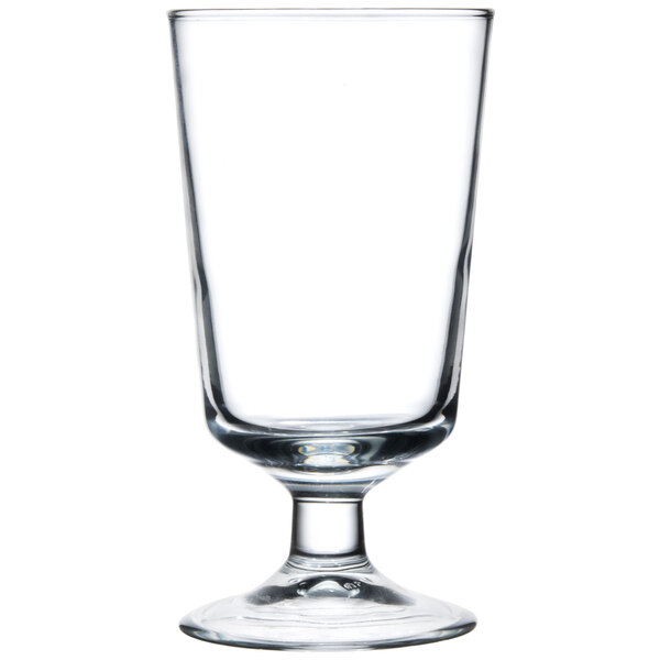An Arcoroc footed highball glass with a white background.