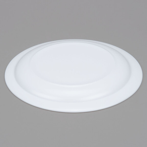 A white Arcoroc glass side plate with a narrow rim.