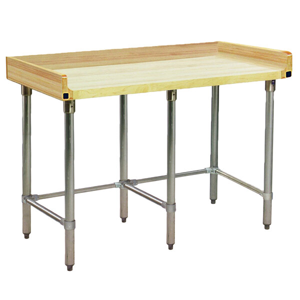 An Eagle Group wood top work table with a stainless steel base and backsplash.