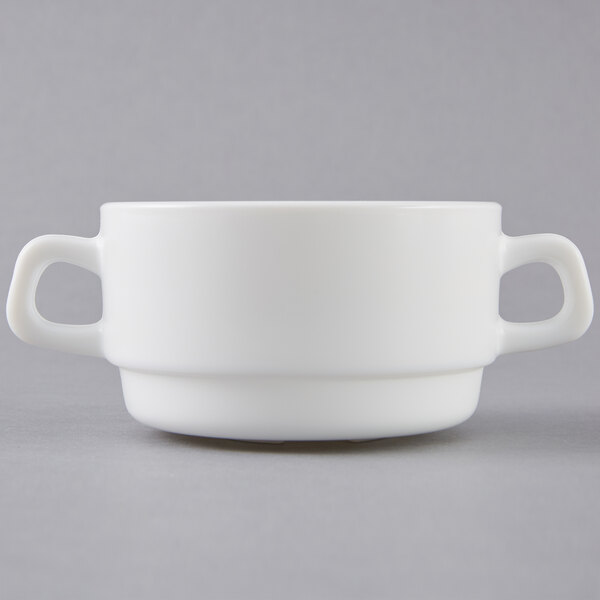 A white Arcoroc double handled bowl.