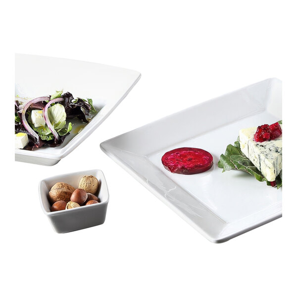 A square white Tuxton china bowl filled with food.