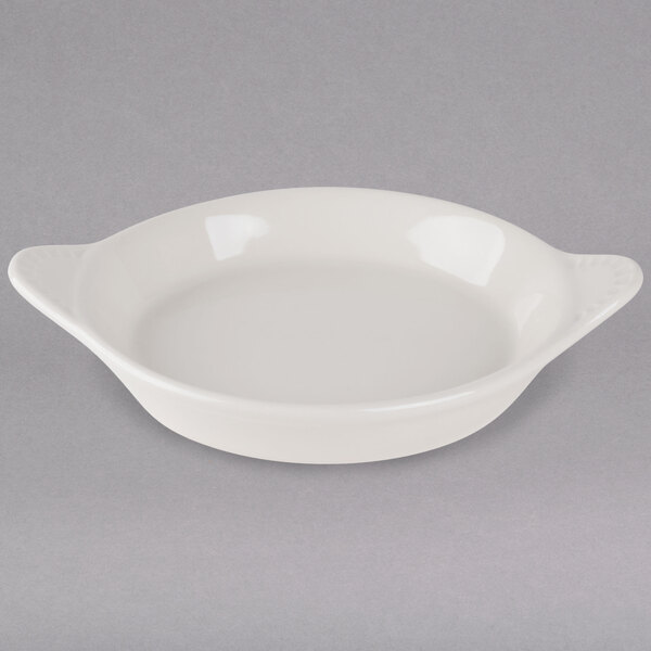 A white bowl with two handles.