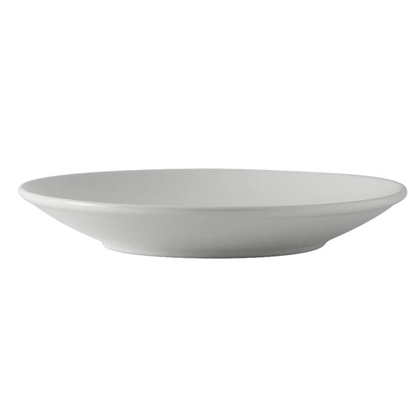 A close-up of a Tuxton white china pasta/salad bowl with a rim.