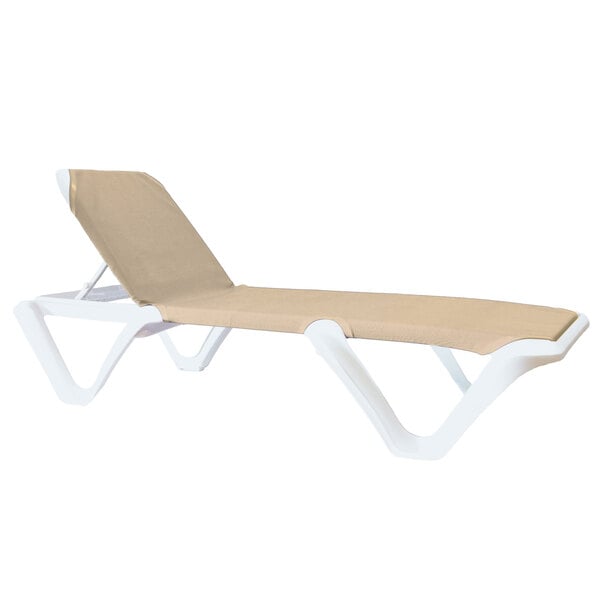 A white and tan Grosfillex Nautical sling chaise lounge with white legs.