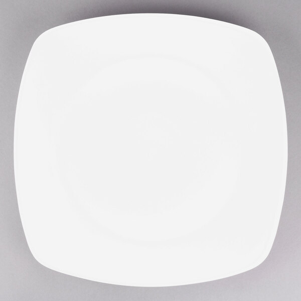 A white square Tuxton china plate with a white rim.