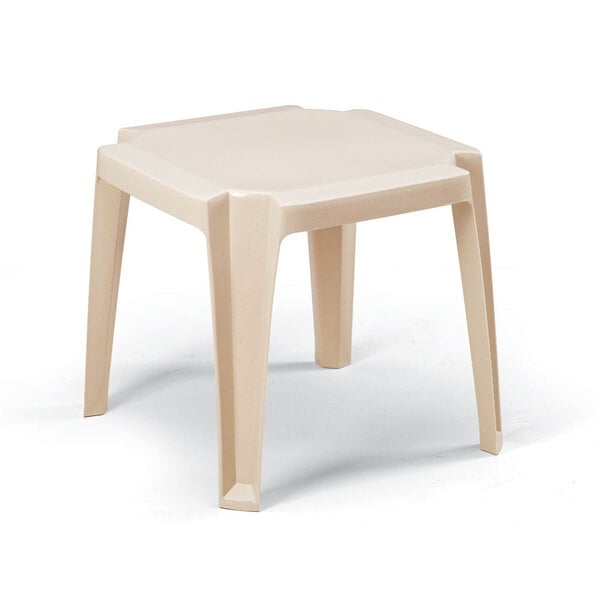 A white plastic Grosfillex low table with legs.