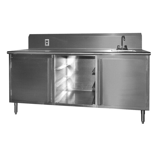 A stainless steel beverage table with a sink on the right and two doors.