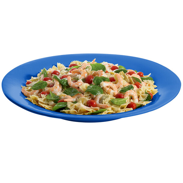 A Cobalt blue Tablecraft cast aluminum platter with pasta, shrimp, and spinach.