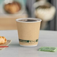 Air pocket insulated cup holding coffee