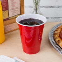 Polystyrene cup holding soda