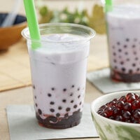 two cups of bubble tea topped with cheese cream