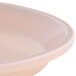 A close-up of a light peach Cambro Camtray.