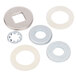 A group of silver metal washers and nuts.