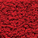 A close up of a red Cactus Mat with a pattern of small red flowers.
