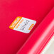 A National Checking Company Saturday food labeling sticker on a red surface.