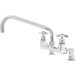 A chrome T&S deck-mounted faucet with red and blue knobs.