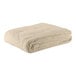 A folded beige Oxford full size thermal herringbone hotel blanket.